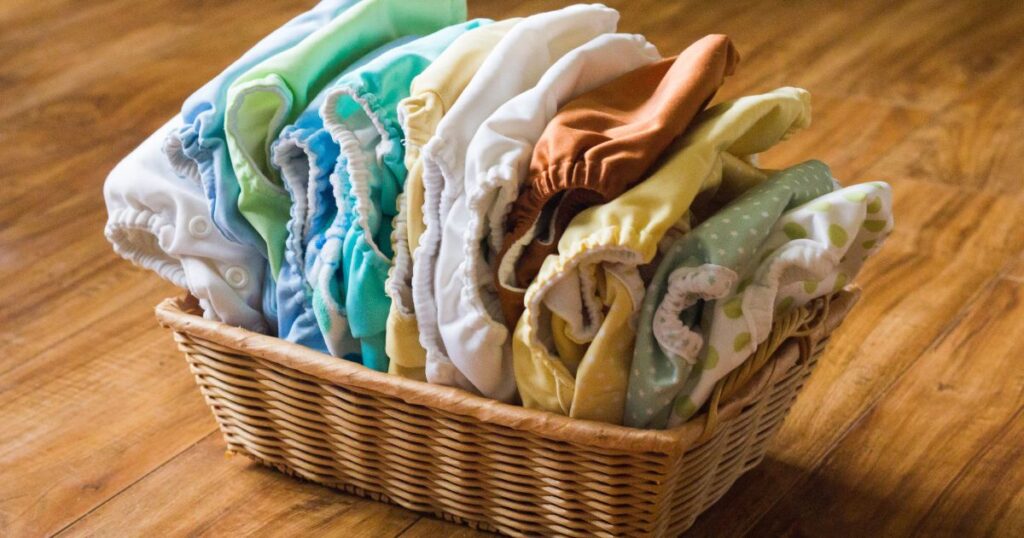 keep-cloth-diapers-white-brown-small-basket-with-numerous-cloth-diapers-inside