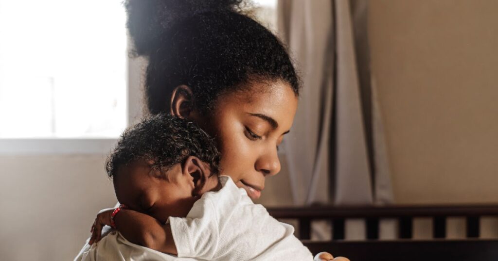 carrot-fertility-mother-holding-her-baby-close-gently-smiling