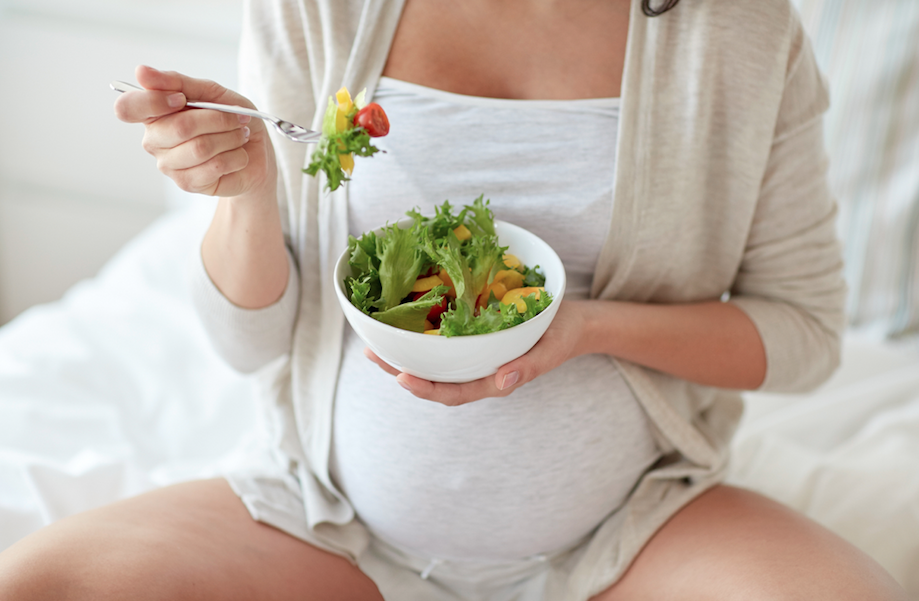 Mom eating superfoods dense meals during pregnancy