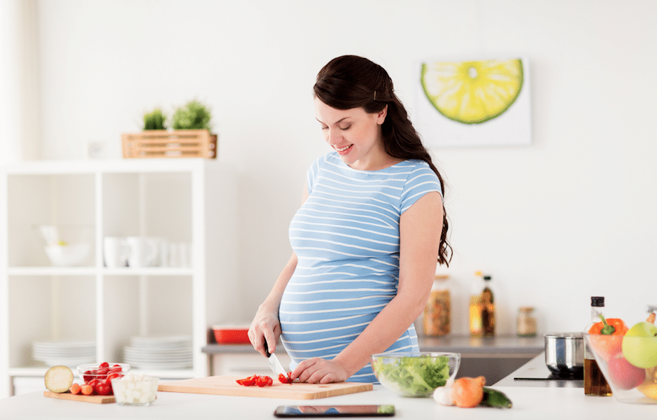 Mom preparing superfoods dense meals during pregnancy