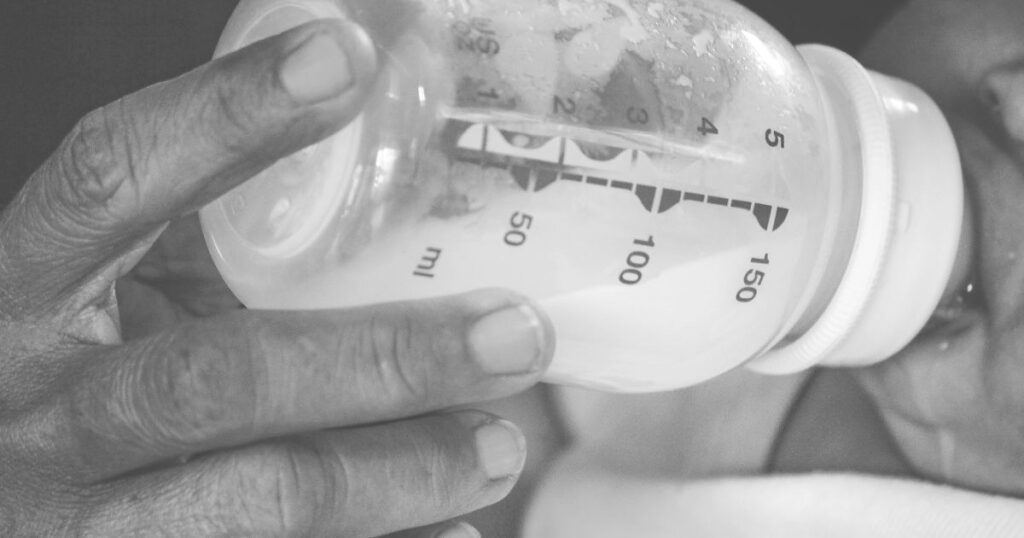 woman-bottle-feeding-a-newborn-baby