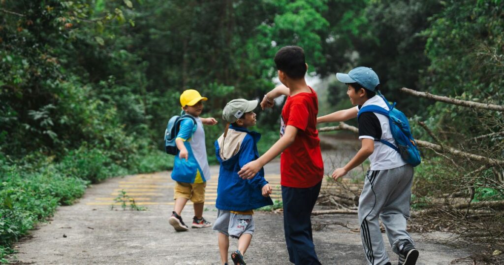 things-to-do-in-charlotte-with-kids-children-on-a-hike-in-the-woods