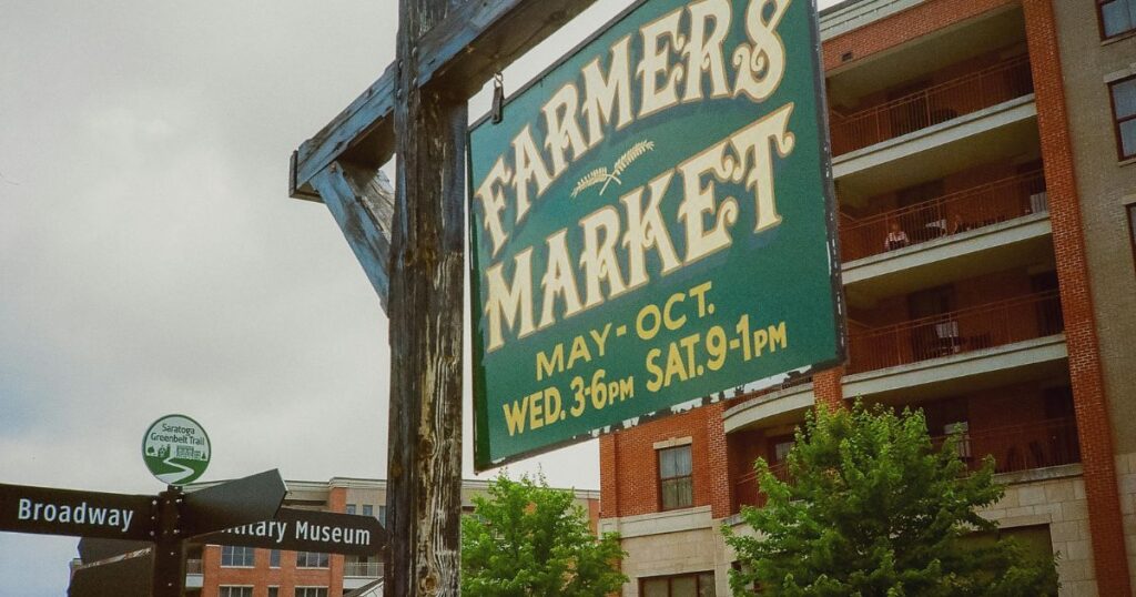 best-farmers-markets-in-Charlotte-for-organic-produce-sign-promoting-seasonal-local-shopping-and-community-events