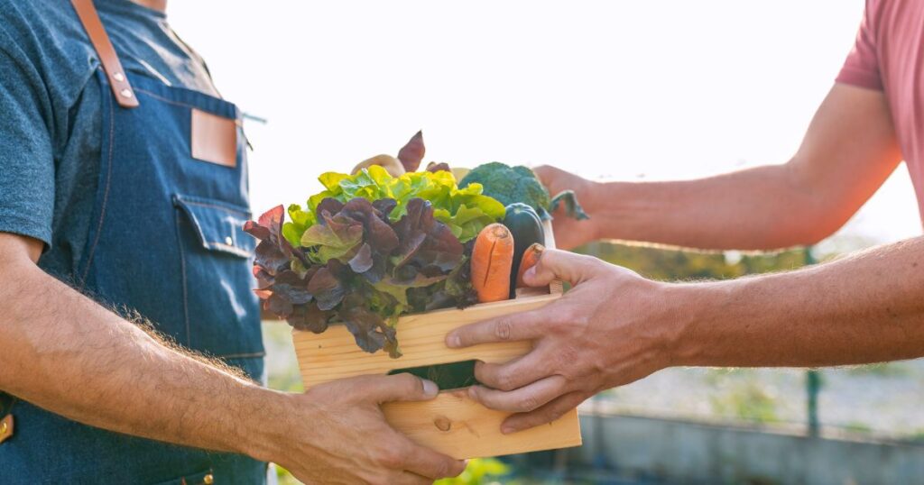 Farmers-market-Charlotte-NC-with-fresh-local-vegetables-and-produce-being-shared