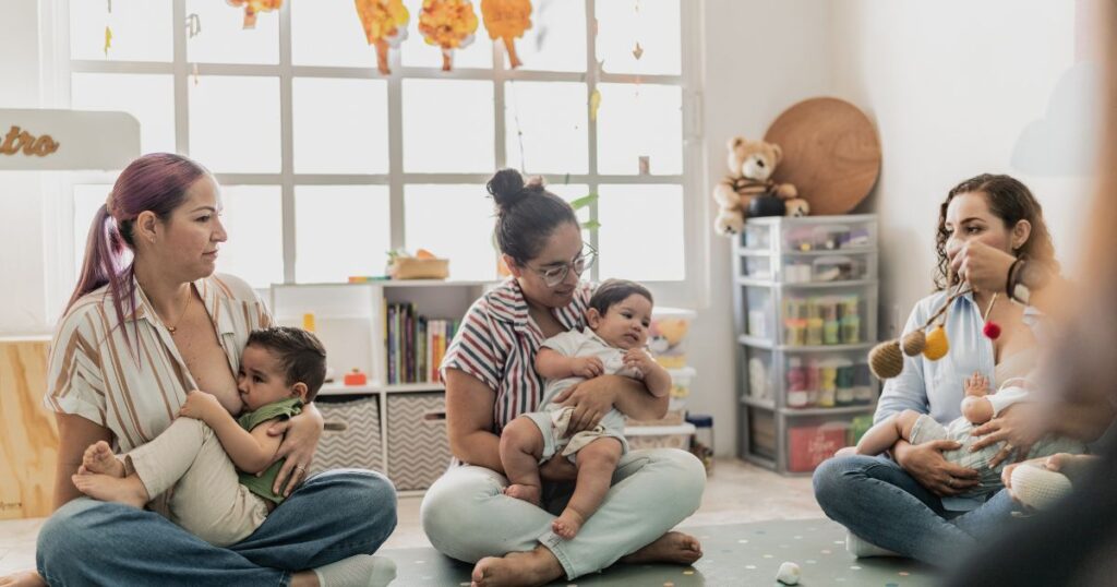 Parenting-classes-Charlotte-NC-with-mothers-practicing-baby-care-skills-in-a-supportive-group-setting