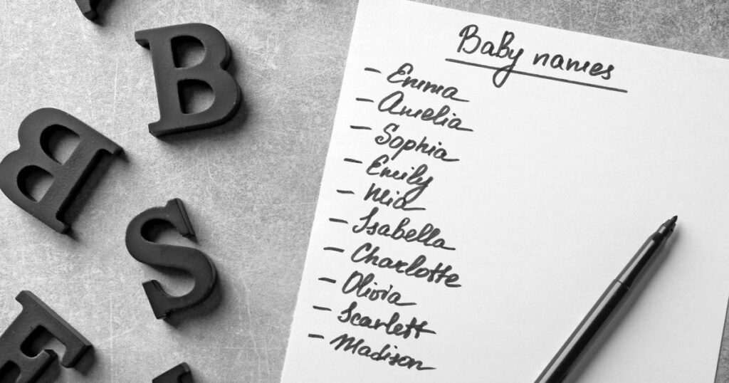 List of baby names for a girl handwritten on paper