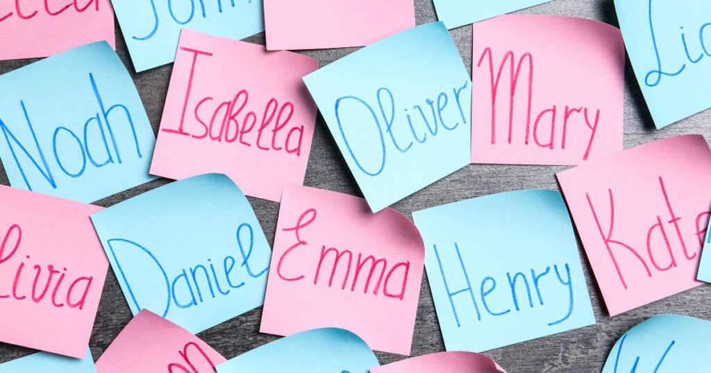 handwritten baby names on blue and pink sticky notes
