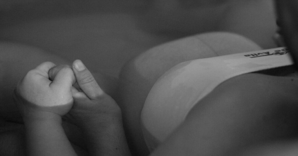 Mom laboring in water in birth tub at birth center in Charlotte, NC