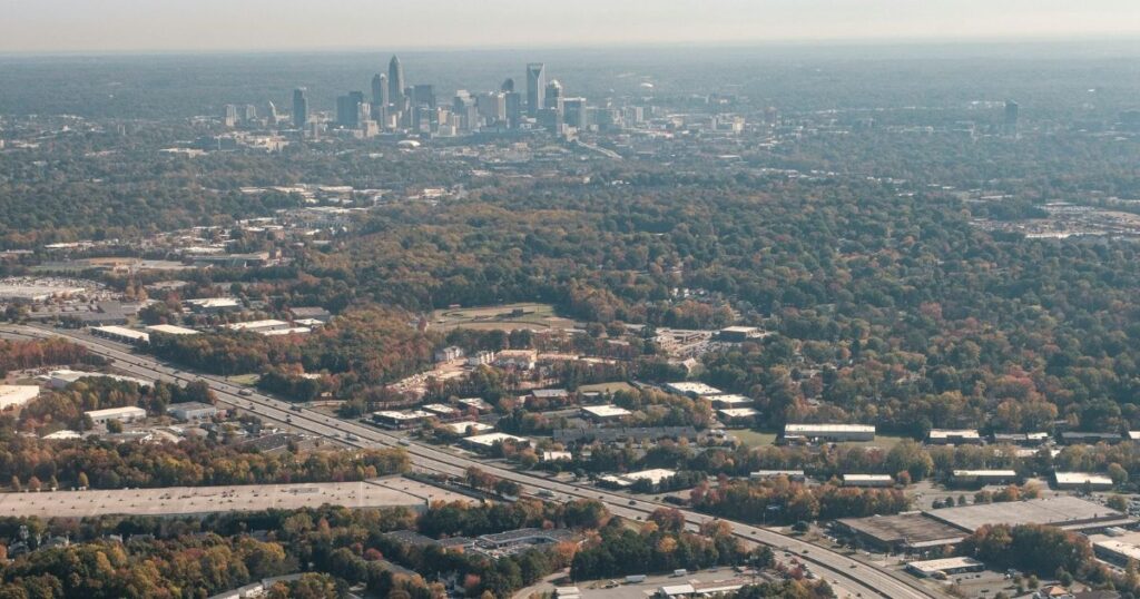 Aerial view of Charlotte skyline and surrounding neighborhoods
