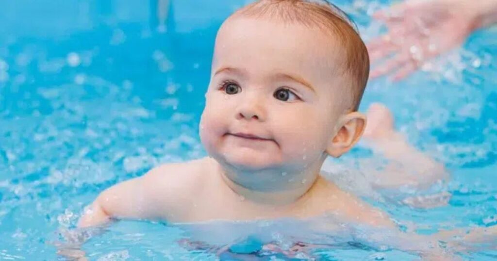 Baby swimming in the pool