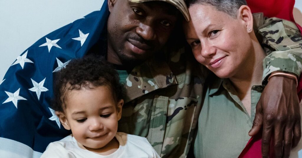 family photo of a military man with his son and wife