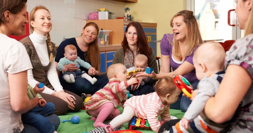 a group of mothers and their babies enjoying each others' company in a mom group