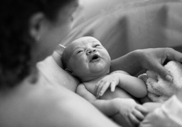 mom-holding-baby-after-birth